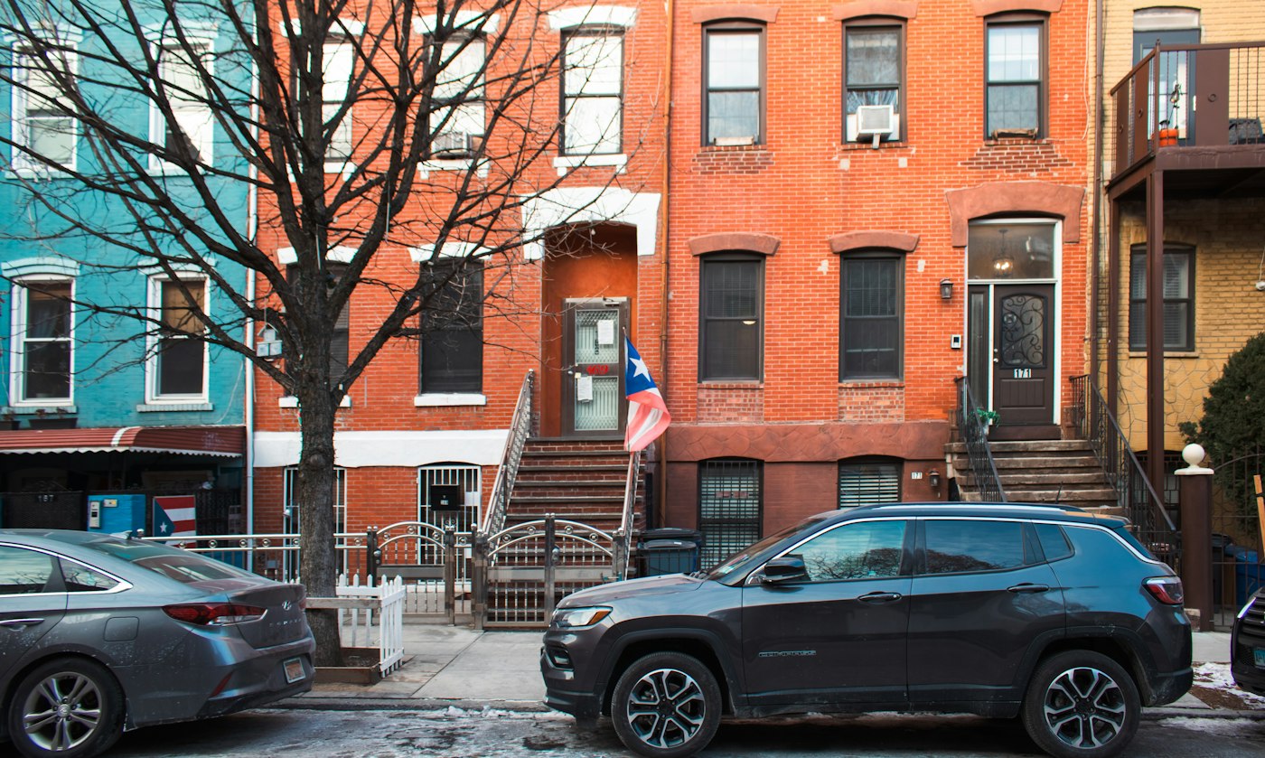 Row of colorful townhouses on a residential street